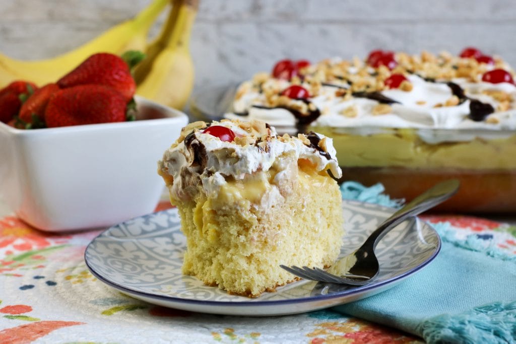 Banana Split Poke Cake is all the delicious flavors of a banana split in an easy-to-make sheet cake.