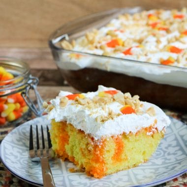 Do you like candy corn? I'm totally on Team Candy Corn! Even if you just like it a little, I think you are going to absolutely love this easy-to-make Candy Corn Poke Cake. I happen to be a huge fan of both candy corn and poke cakes so this Halloween dessert is totally for me. A delicious moist cake that not only is delicious involves candy corn. This festive poke cake recipe is perfect for the Halloween and Fall season.