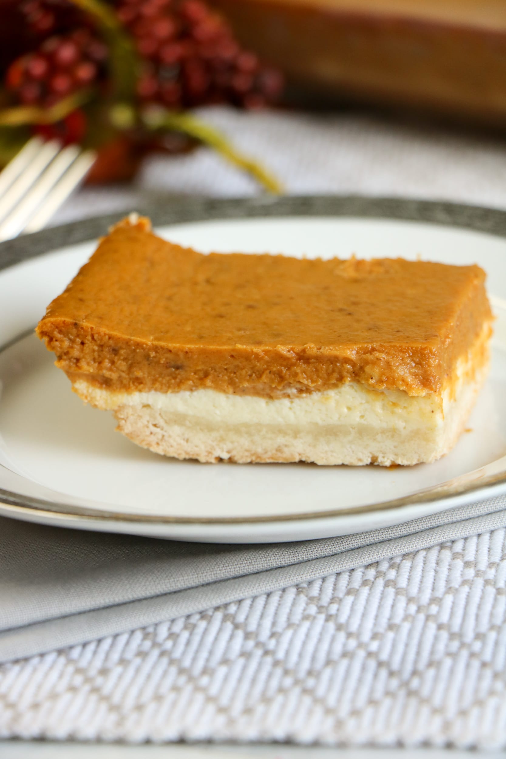 These are definitely the BEST pumpkin cheese cake bars and is a terrific pumpkin dessert recipe for Thanksgiving and the holiday season. 