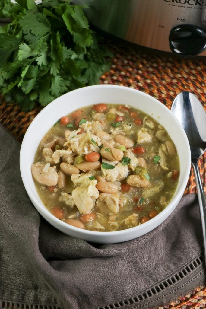 This Slow Cooker White Chicken Chili recipe is the perfect meal to share with your friends and family. You can enjoy after a busy day or a crazy schedule.
