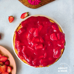 Creamy strawberry cheesecake with a graham cracker crust is topped with a fresh, homemade strawberry sauce. This is a simple classic dessert that is perfect for every occasion and is most certainly an early spring treat.