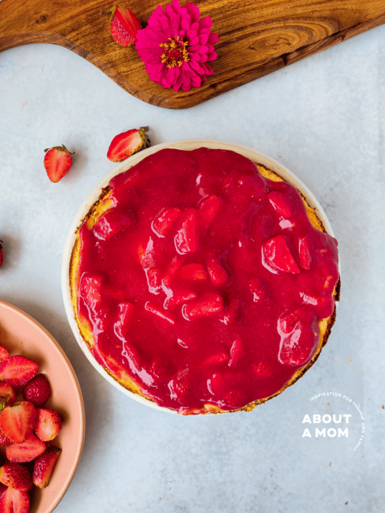 Creamy strawberry cheesecake with a graham cracker crust is topped with a fresh, homemade strawberry sauce. This is a simple classic dessert that is perfect for every occasion and is most certainly an early spring treat.