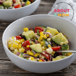 This Fresh Corn Salad recipe is full of flavor with fresh-from-the-cob corn, tomatoes, cucumber, red onion, feta cheese, a simple homemade vinaigrette and more.  Serve this Fresh Corn Salad as a summer lunch or a delicious side dish alongside your favorite BBQ!