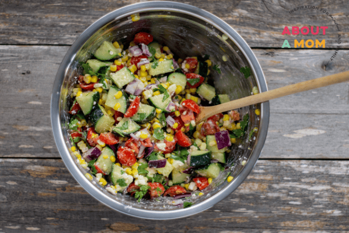 Mixing Corn Salad ingredients