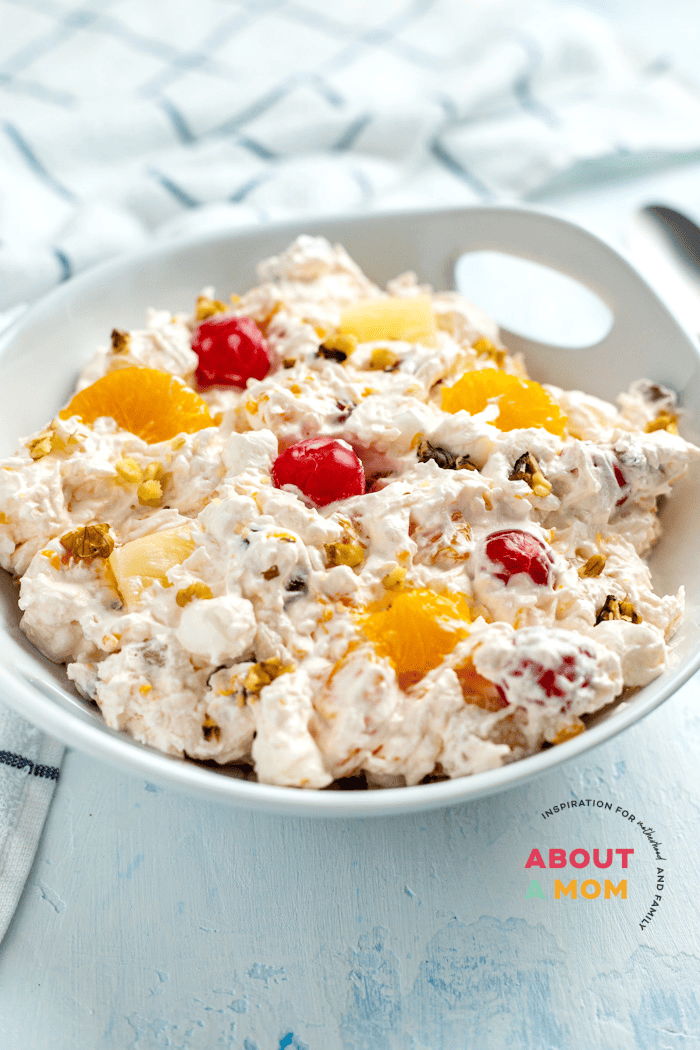Ambrosia Salad is a classic fruit salad that's been around since the days of potlucks. This easy fruit salad is perfection with a sweet and fluffy whipped cream dressing, soft mini marshmallows and colorful fruit.