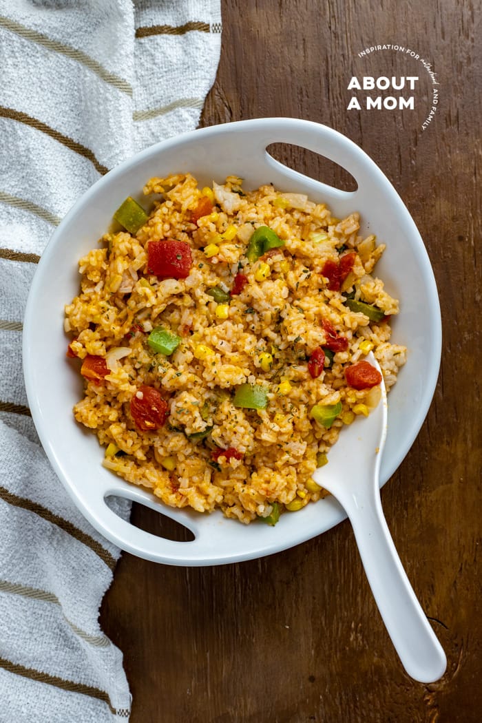 This is the best easy cheesy Mexican rice recipe. It is a restaurant-style Spanish rice recipe that comes together in no time. Serve this flavorful Mexican side dish with your favorite enchiladas or chimichangas. It is the perfect side for Taco Tuesday!