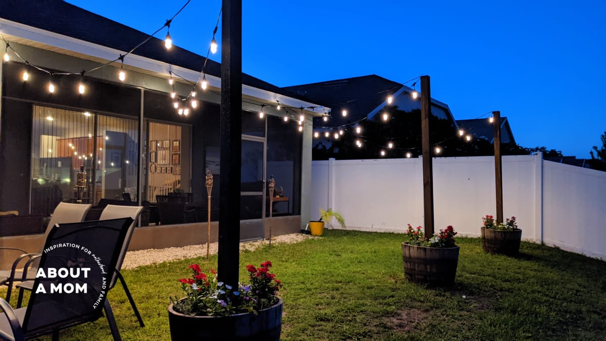 Have you wondered to to hang outdoor string lights? Make whiskey barrel planters with built-In posts for string lights. Add ambiance to your backyard with this step-by-step tutorial for a DIY planter with pole for string lights. 