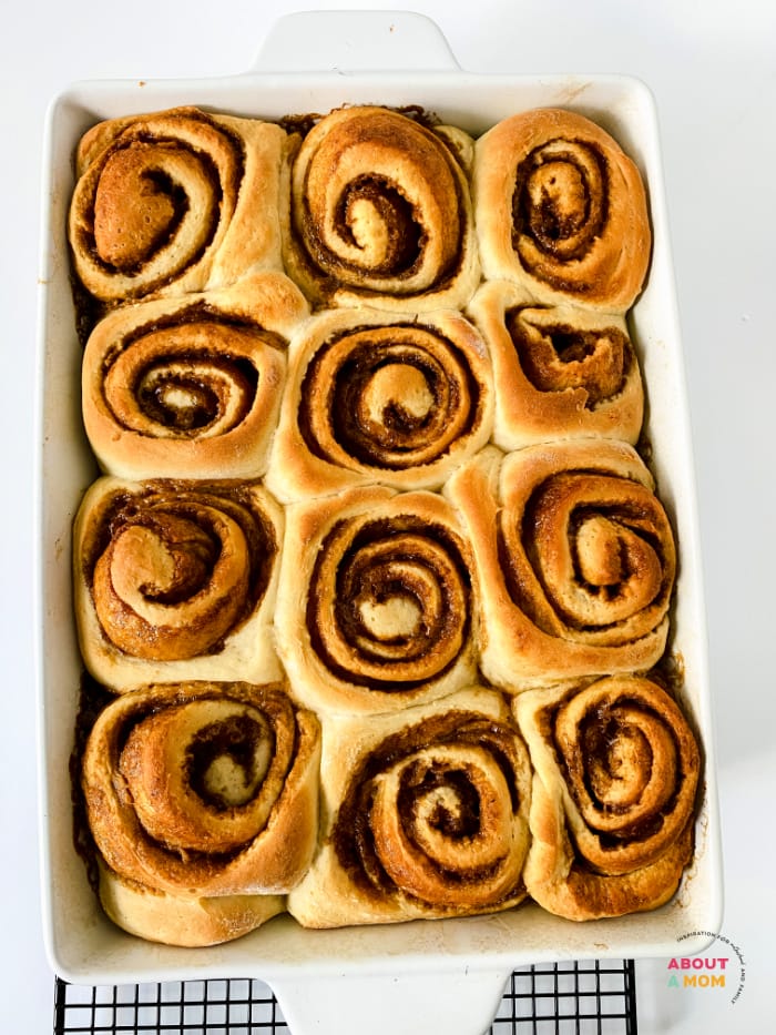 cinnamon rolls cooling in baking sheet