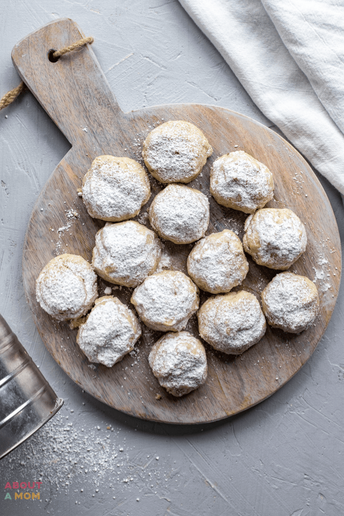 Pecan Snowball Cookies are such a treat with a tender shortbread base, studded with crunchy pecan pieces and a powdered sugar finish. These classic Christmas cookies are a fun way to satisfy your cookie craving without overindulging. Snowball cookies are also known as Russian Tea Cakes and Mexican Wedding Cookies.
