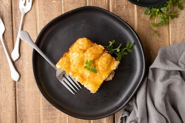 Filled with sausage, eggs, and cheese over tasty tater tots, this tater tot breakfast casserole is sure to get your morning off to a great start.