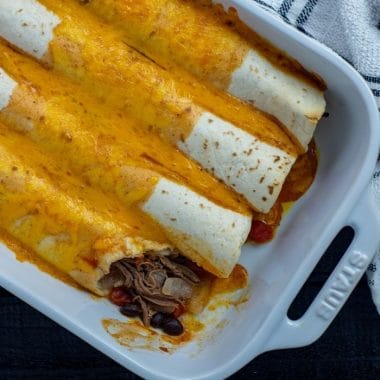 Beef Enchiladas made easy! This Shredded Beef Enchiladas recipe is made with leftover pot roast and is perfect for a busy weeknight.