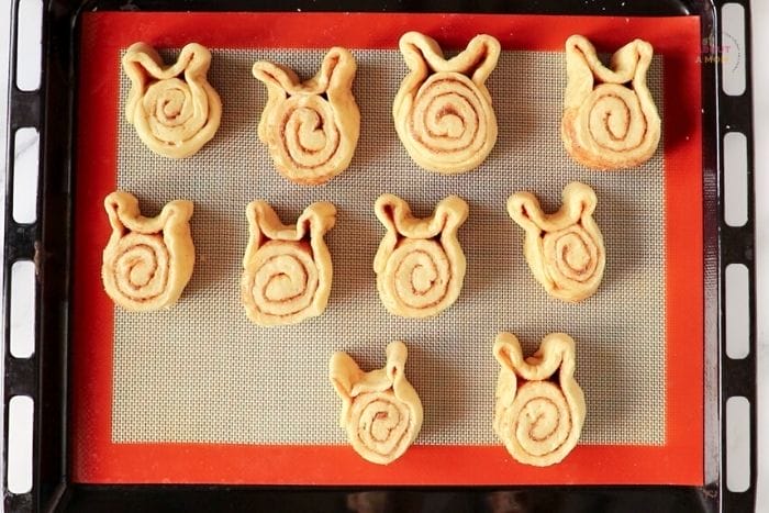 easter bunny cinnamon rolls on a pan