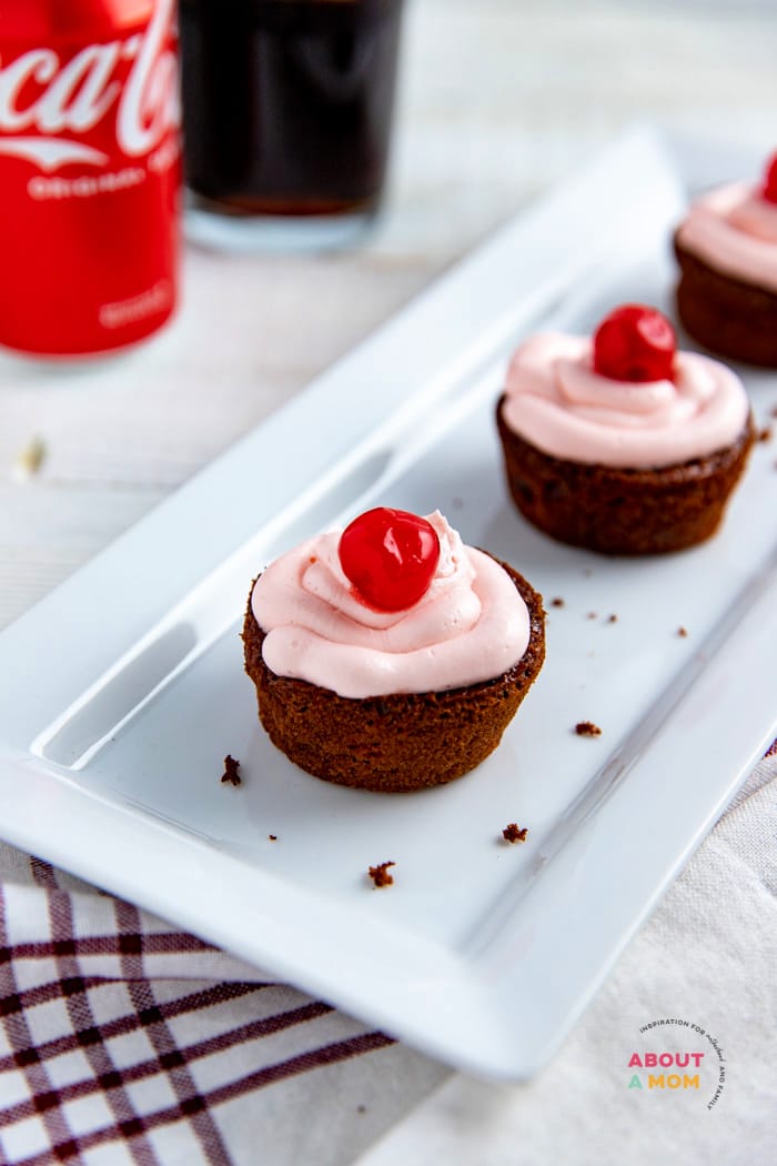 These Chocolate Cherry Coca Cola Cupcakes have a surprise inside that make them incredibly moist. The cupcakes get their amazing flavor from Coca-Cola, cherry pie filling and maraschino cherry liquid.